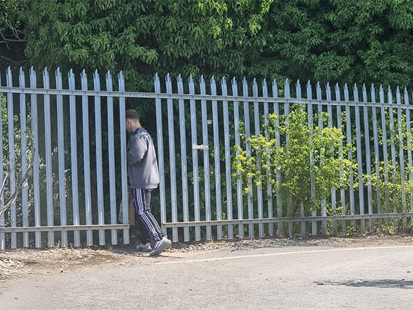 Broken palisade fence
