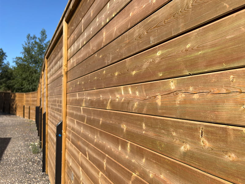 Acoustic barriers for dog boarding kennels
