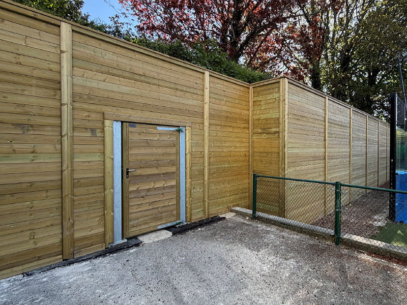 Padel court acoustic barrier and gate