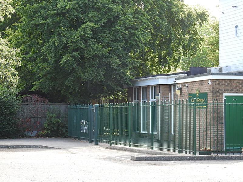 Bow top fencing around school