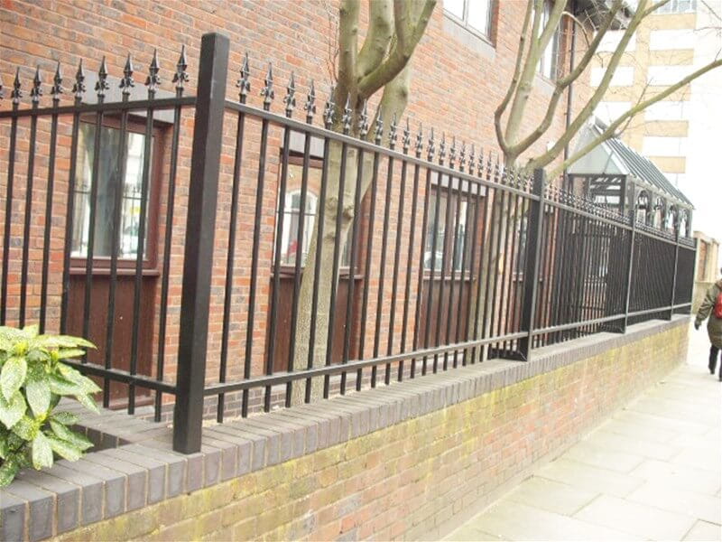 Ornamental fencing cranked on to wall