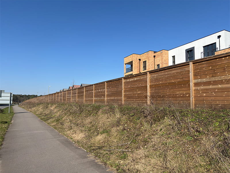 Jakoustic barrier for roadside homes