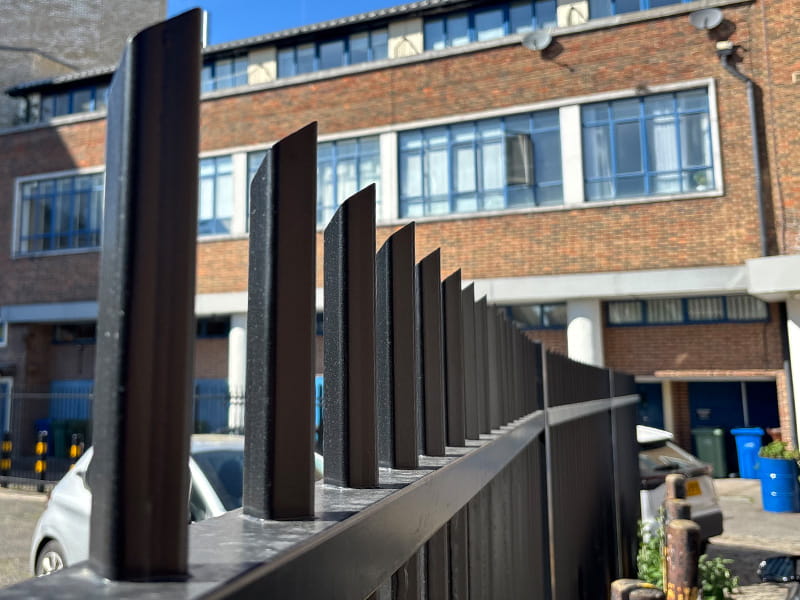 Secure vertical bar fencing