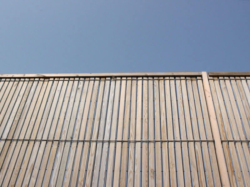 Timber and steel mesh fencing
