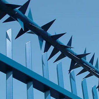 Rotating fence spikes