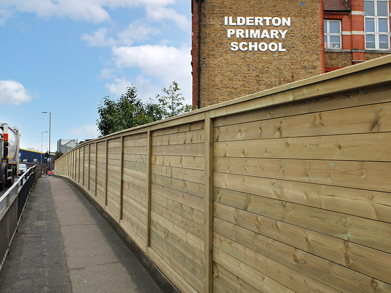 Acoustic barrier protecting a school
