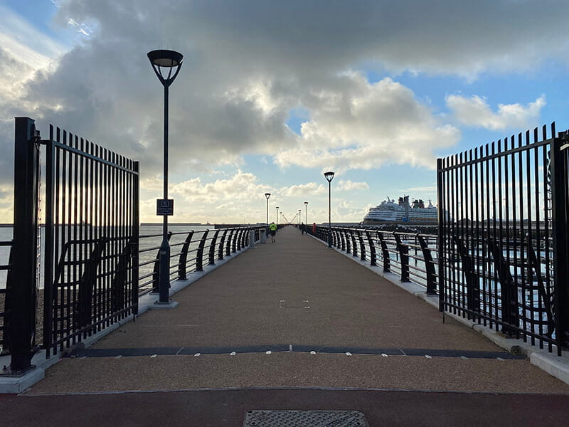 Open double leaf vertical bar security gates at Dover pier