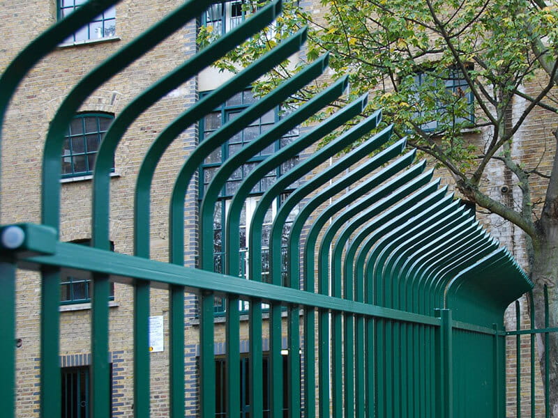 Green Vertical Bar Fencing with Cranked Pales