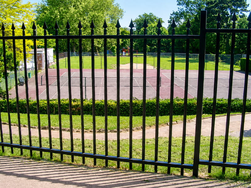 Secure decorative vertical bar fencing with finials