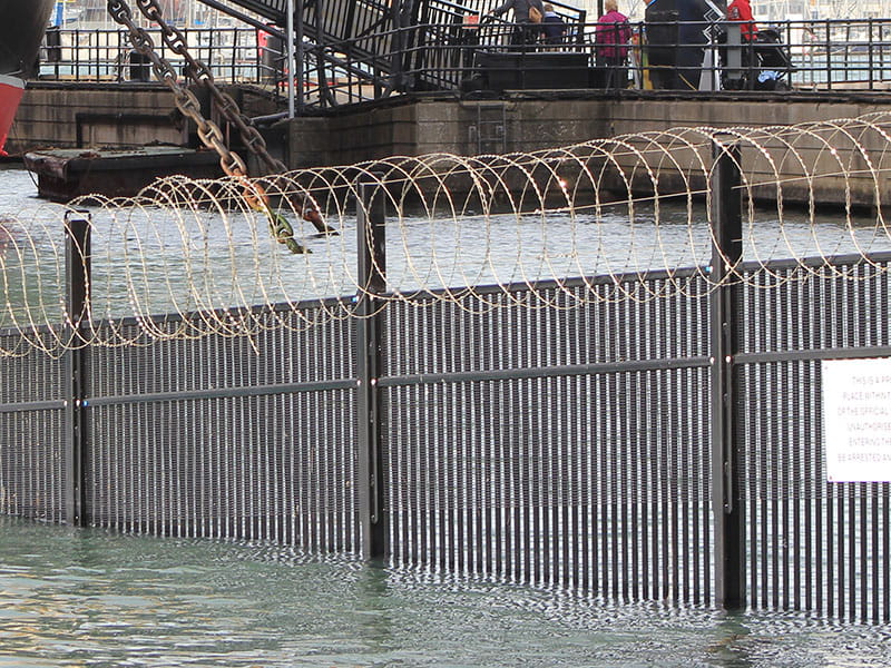 Barbed wire fence topping
