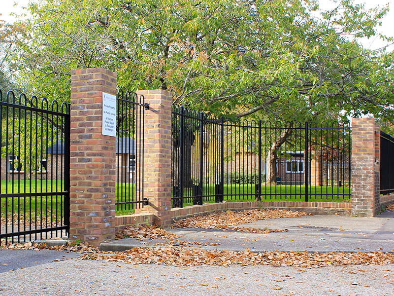 metal railings on brick wall