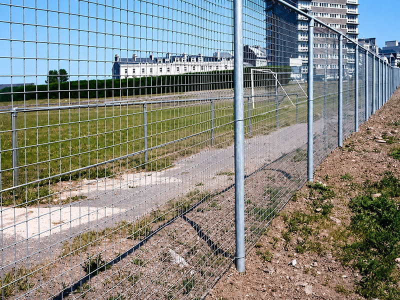 Tubular fencing system with welded mesh