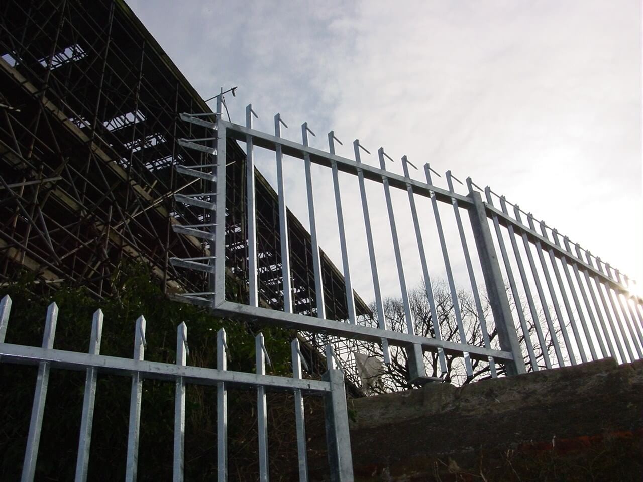 Barbican Barbed Top Stepped Vertical Bar Fencing