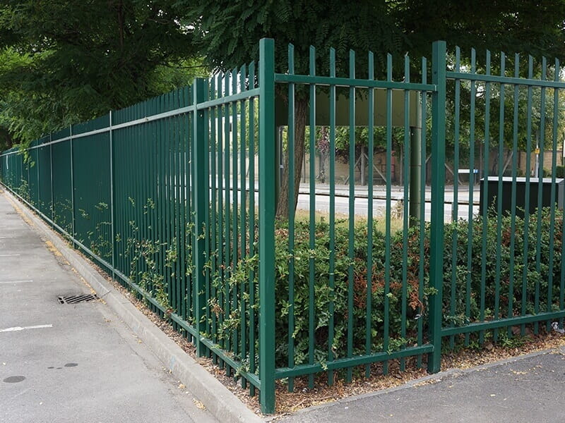 Green vertical bar railings